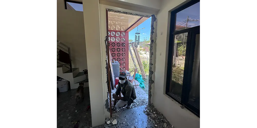Make no mistake! He's not a burglar. He's Mr. Nelson, the guy who installed the door.